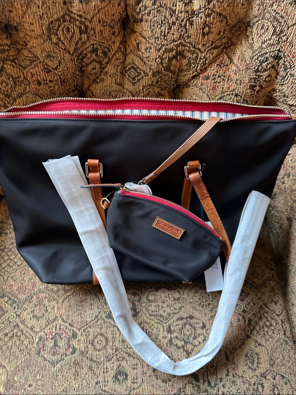 Dooney & Bourke Black Tote with Tan Trim key fob and matching small make up bag. - Picture 3 of 4